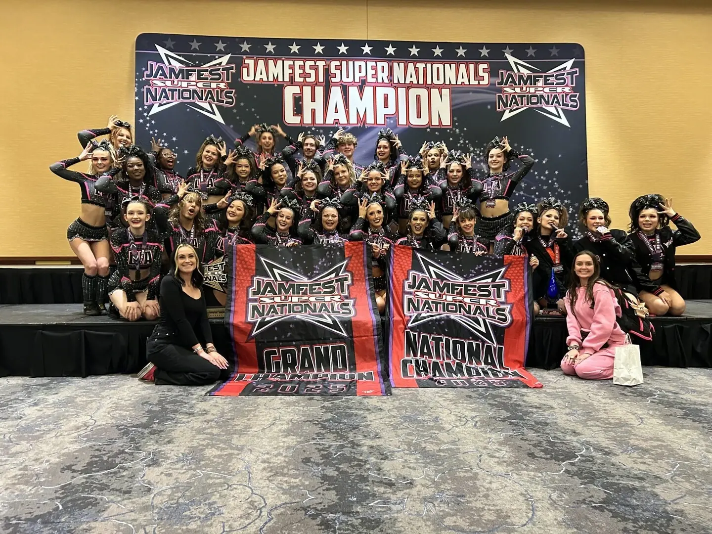 Las Vegas All Stars team with Jamfest Super Nationals Grand Champion banners